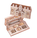 An overhead close-up of an open Flowerknows Sweetie Bear 6-color eyeshadow palette, revealing a built-in mirror and beautifully embossed nude beige and warm latte matte and shimmer shades.