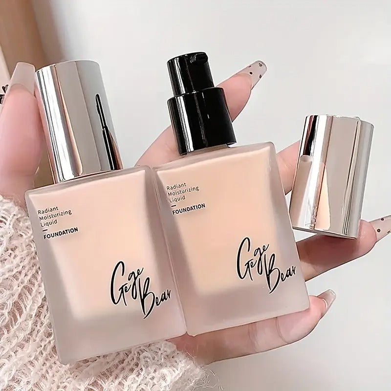 Pack of two Gege Bear moisturizing liquid foundations for dry skin, held in a hand against a white background, perfect for a flawless and long-lasting natural glow.