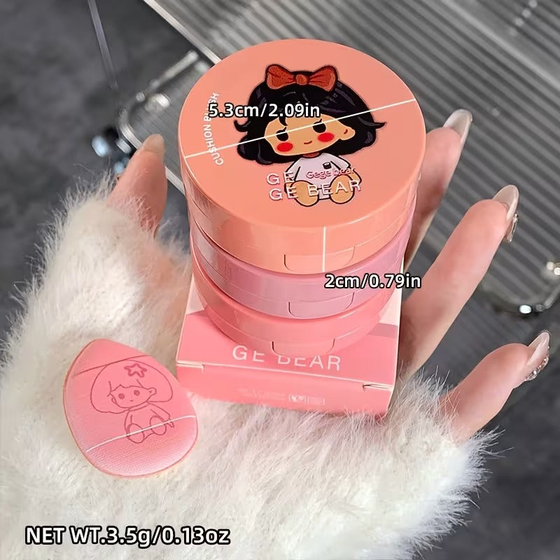 liquid blush with cartoon character on lid, held by a hand.