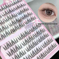 clusters of gege bear fake eyelash extension on a pink patterned packaging 