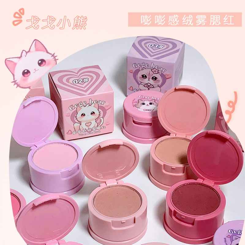 Pink blush compact with packaging and cartoon character on a white background