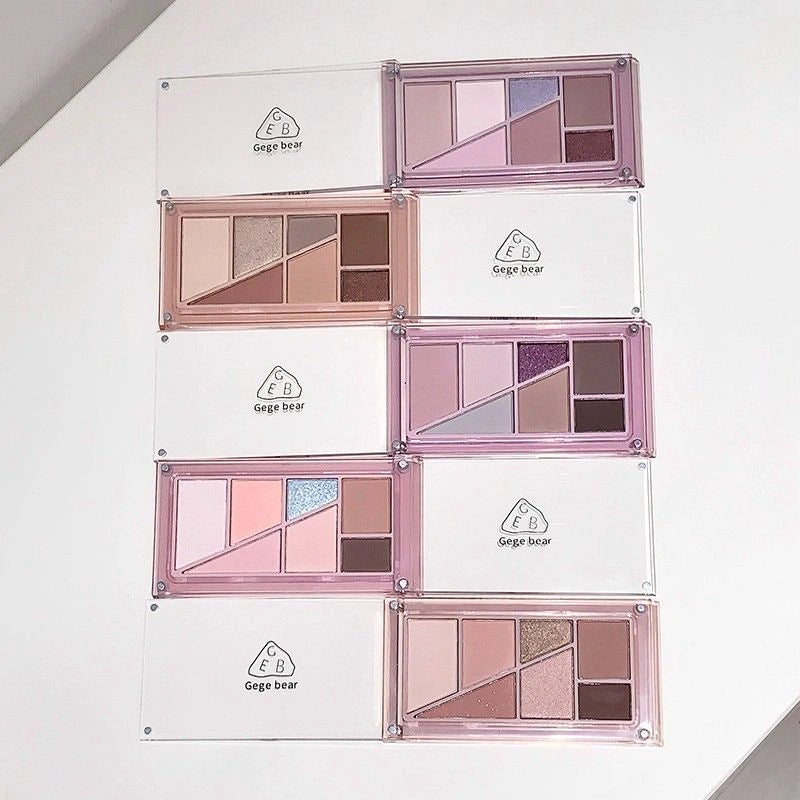 Set of makeup eyeshadow palettes with Gege bear branding on a white background best for gifting 