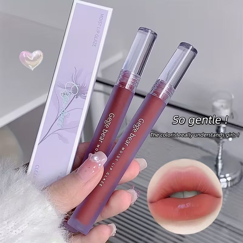 Two lipstick held by a hand with a close-up of lips wearing the product, and a purple box in the background.