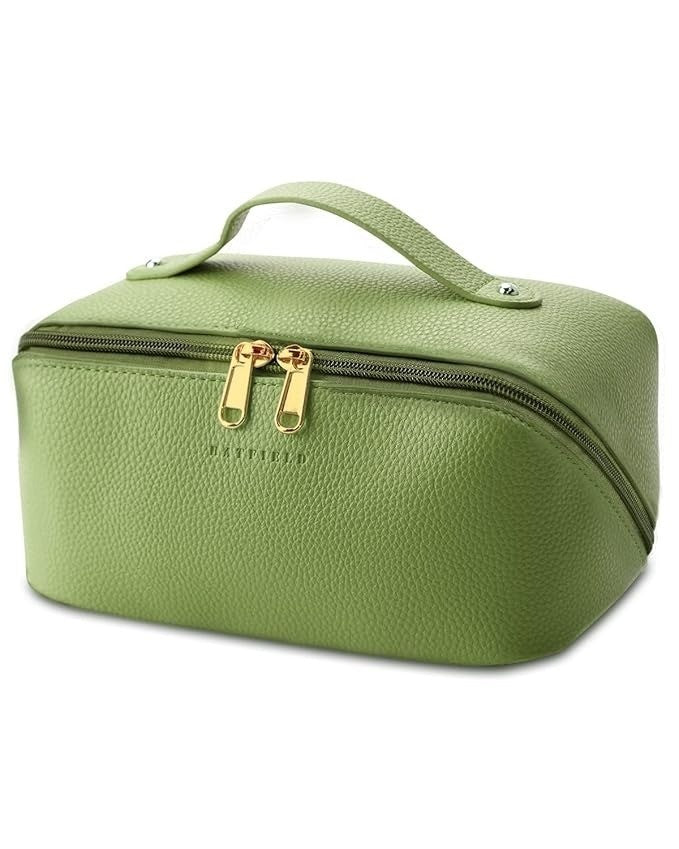 Green toiletry bag with gold zipper on a white background