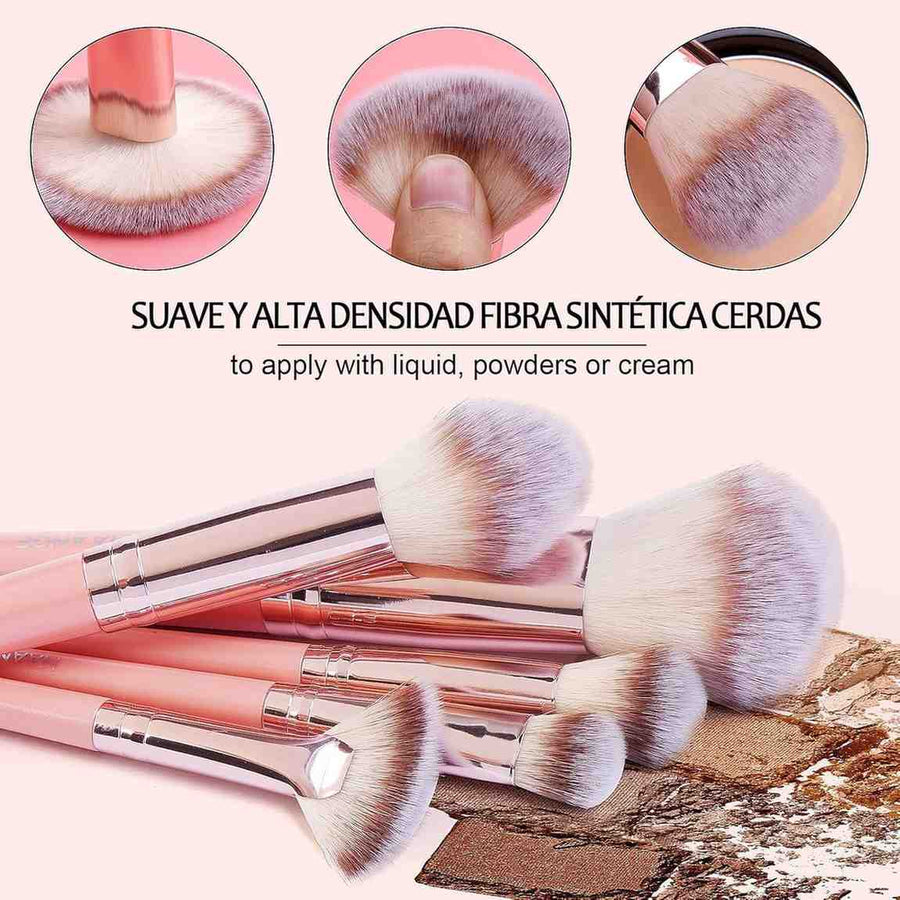 Set of makeup brushes with synthetic bristles on a textured surface.