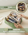 Green cosmetic bag with multiple compartments filled with daily-use items on a light background.