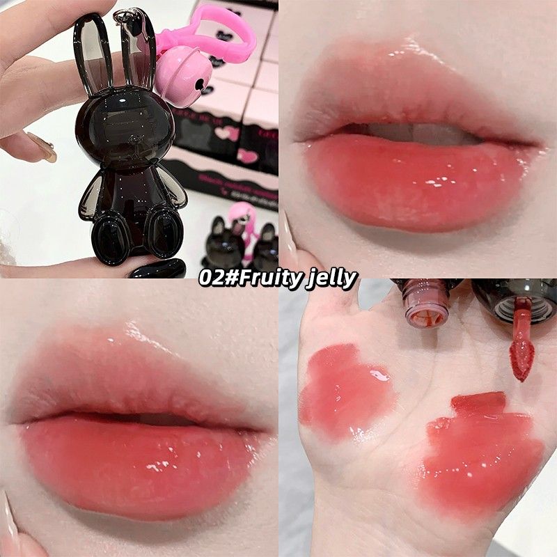 Collage of a lip gloss applicator, close-up of lips with gloss, and gloss swatches on skin.