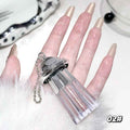 fingers showing the faint golden liqud shimmer eyeshadow and holding the container against the white background 