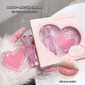 2in1 heart shaped lip balm and transparent lip gloss set a girl hold the set on her hand on a white table 