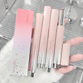 Set of lip products with a box on a white fur surface