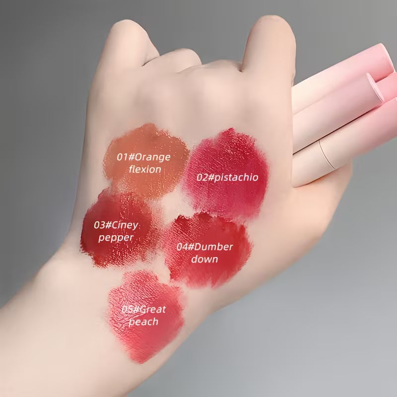 Girl showing Gege Bear matte lipstick swatches on hand with rich pigmentation