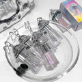 liquid eyeshadow palette on a bowl showing details of a shimmer insite the contain and key chain features cleay shown on the top 