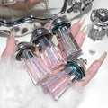 pack of 4 liquid shimmer eyeshadow with  key chain features held by the hand 