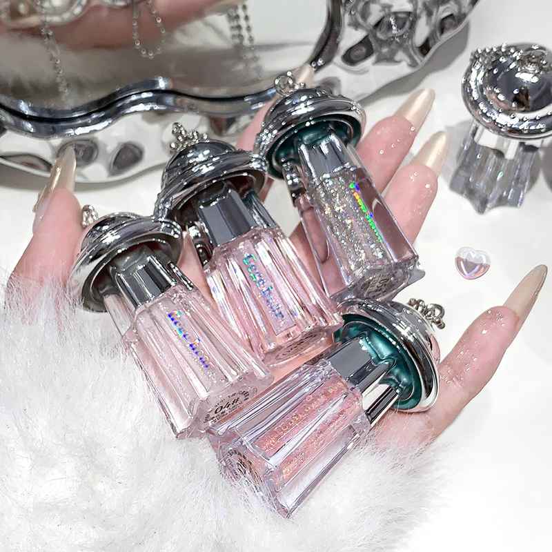 pack of 4 liquid shimmer eyeshadow with  key chain features held by the hand 