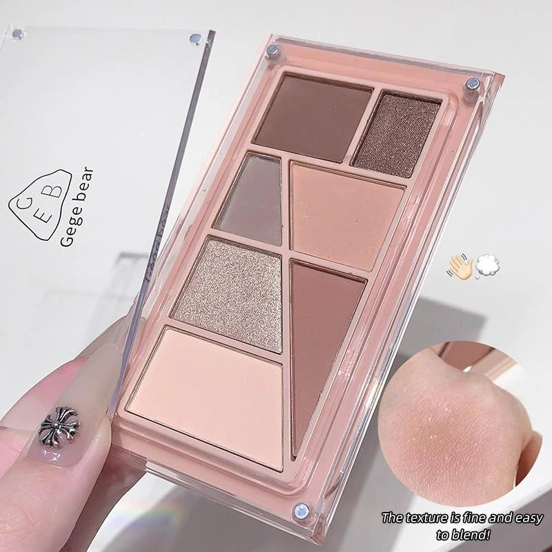 Makeup palette with various shades held by a hand, with 'Gege bear' branding.