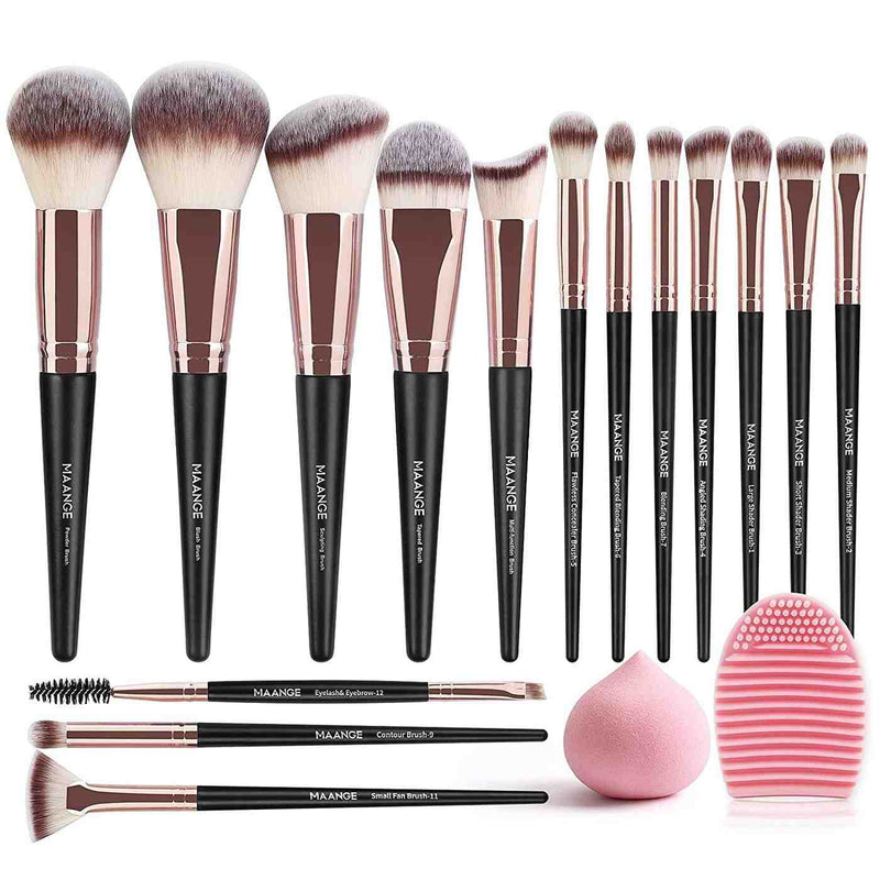 Set of makeup brushes with black handles and rose gold ferrules, accompanied by a pink sponge and puff on a white background.