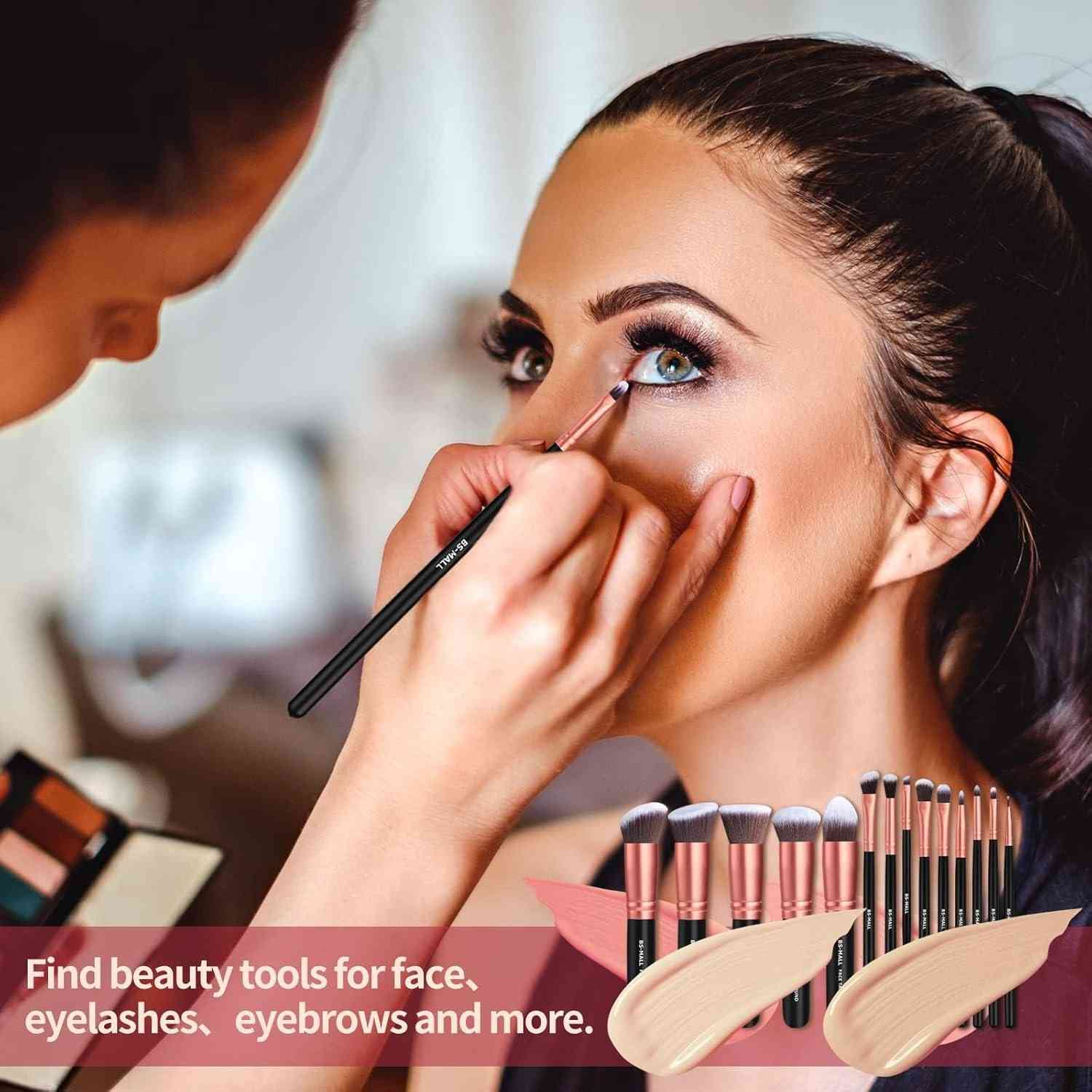 Makeup artist applying makeup to a model with a set of makeup brushes displayed.
