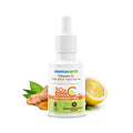 Mamaearth Vitamin C Daily Glow Face Serum with lemon, turmeric, and green leaf on a white background