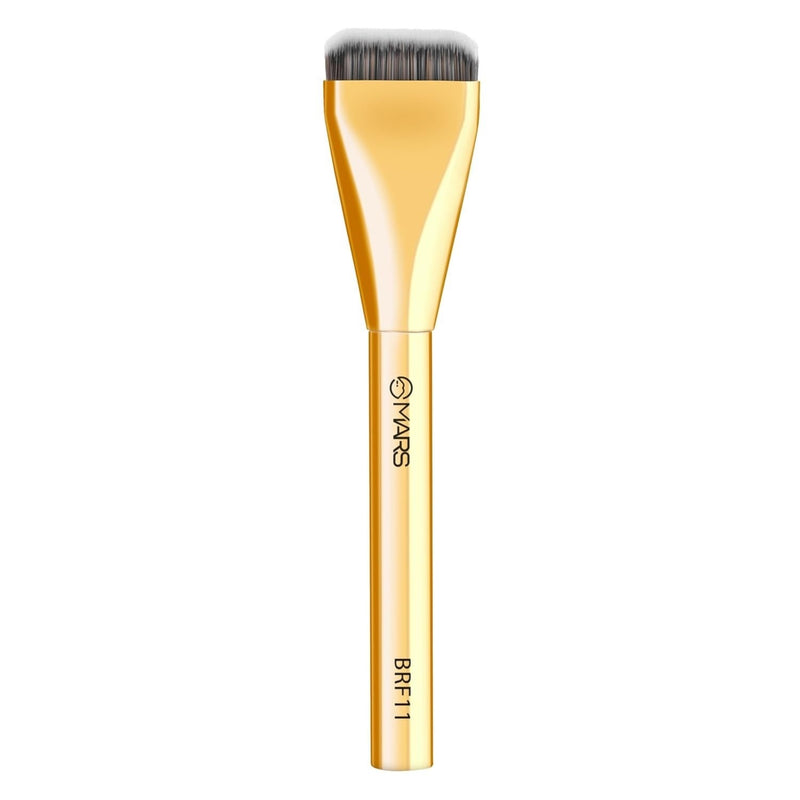 Gold makeup brush with black bristles on a white background