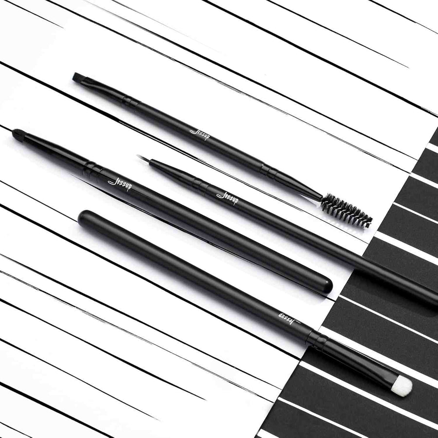 Set of black makeup brushes with 'Jessup' branding on a striped background