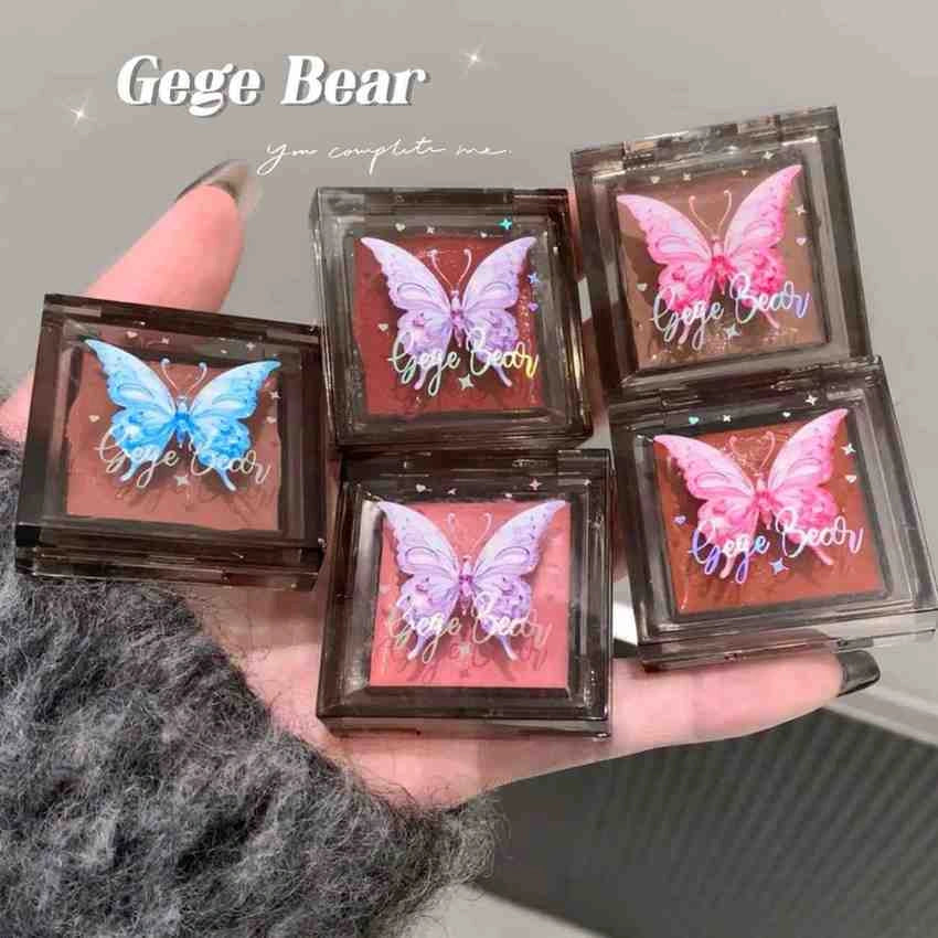 Five butterfly-themed blush for cheeks with 'Gege Bear' branding held in a hand.