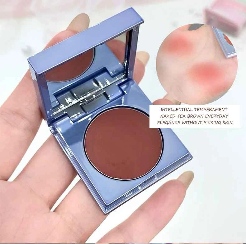 brownn matte blush in a hand with close-up inset showing color on skin