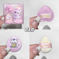 Cute makeup sponge with packaging and accessories on a white background