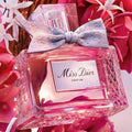 miss dior parfum on a floral background pink radiant