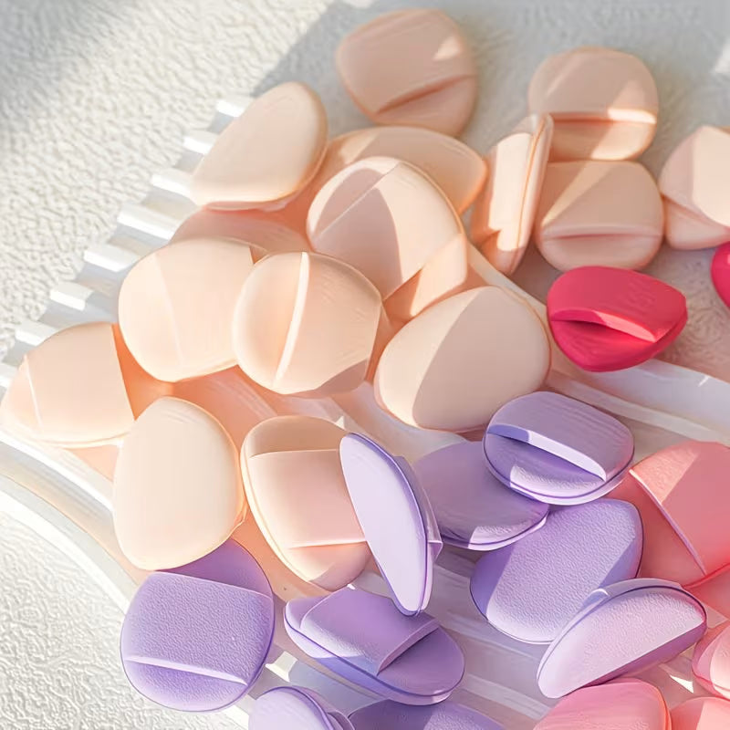 multicolor mini beauty blenders on a tray in a brighly lit room 