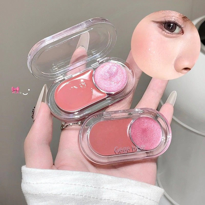 Two small makeup palettes with blushes held by a hand against a neutral background