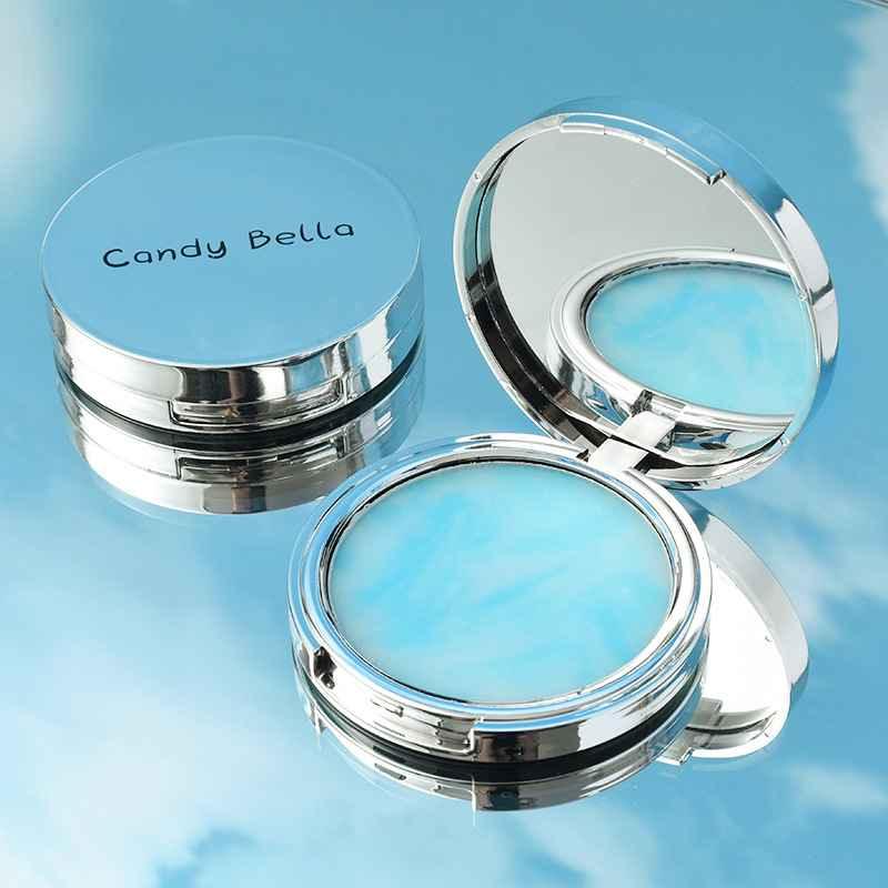 gel compact with 'Candy Bella' branding on a blue background with mirror 