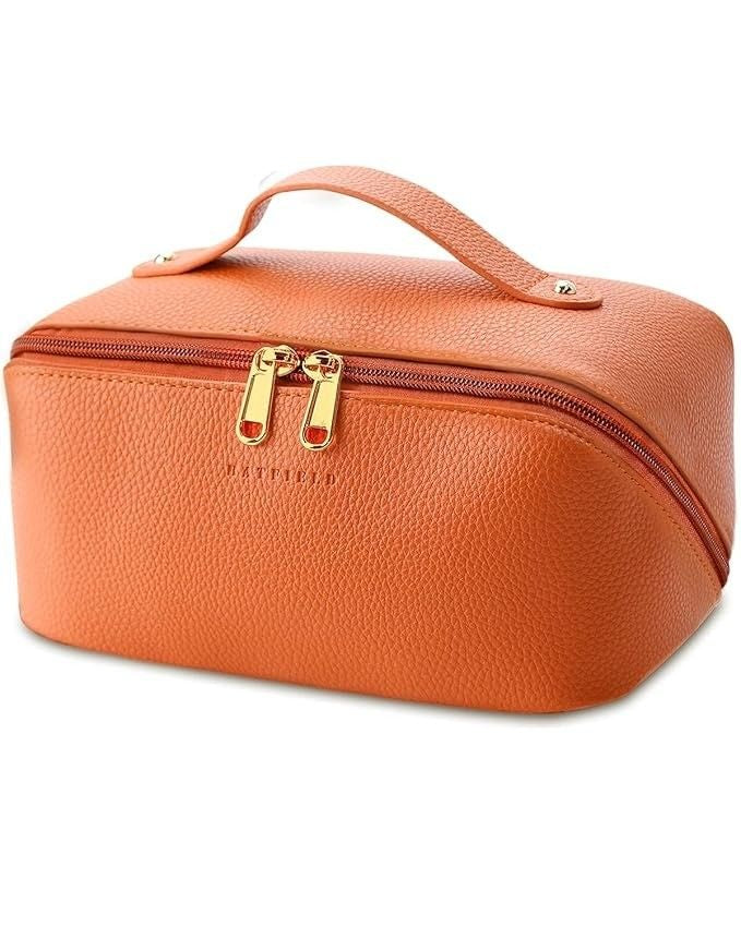 Orange textured travel case with gold zipper on a white background