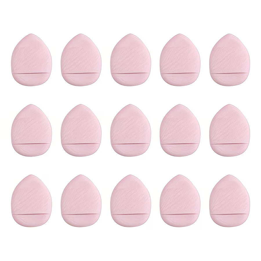 Set of pink finger makeup sponges on a white background