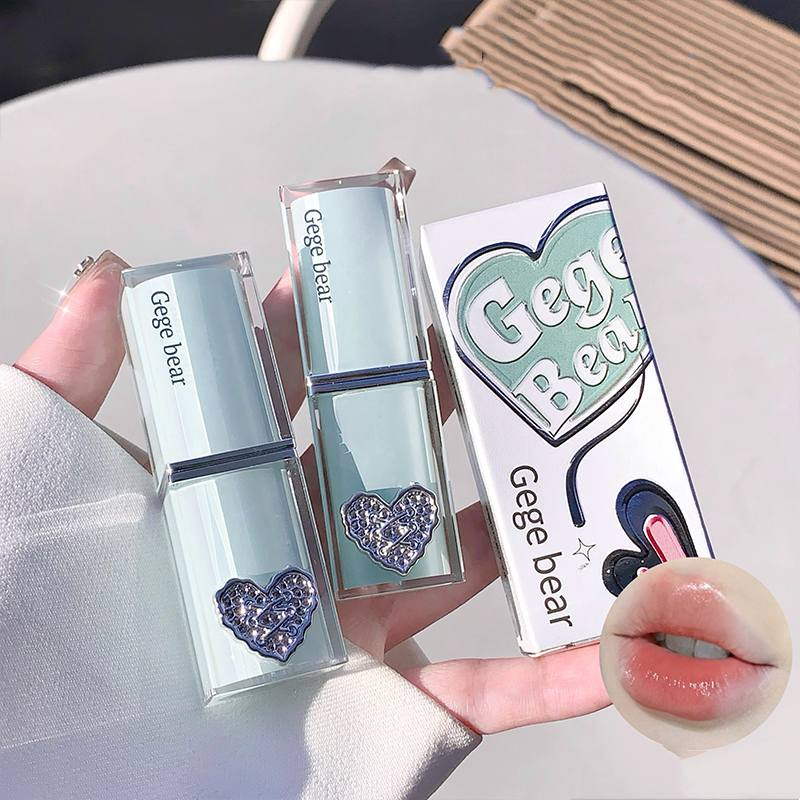 Lipstick with heart design and 'Gege bear' branding, held by a hand.