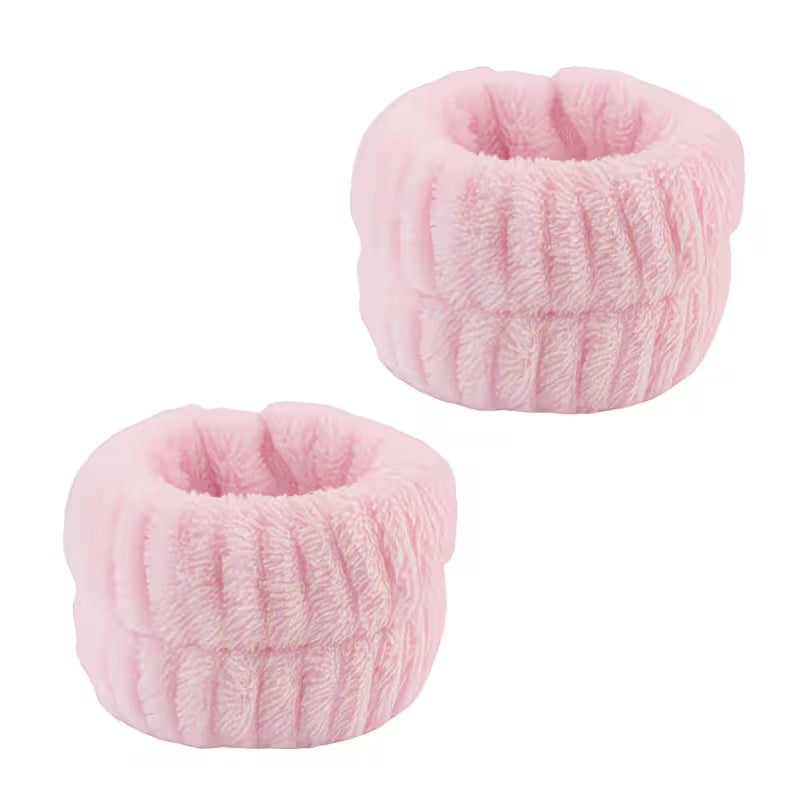 two pink wristbands on a white backgroud 