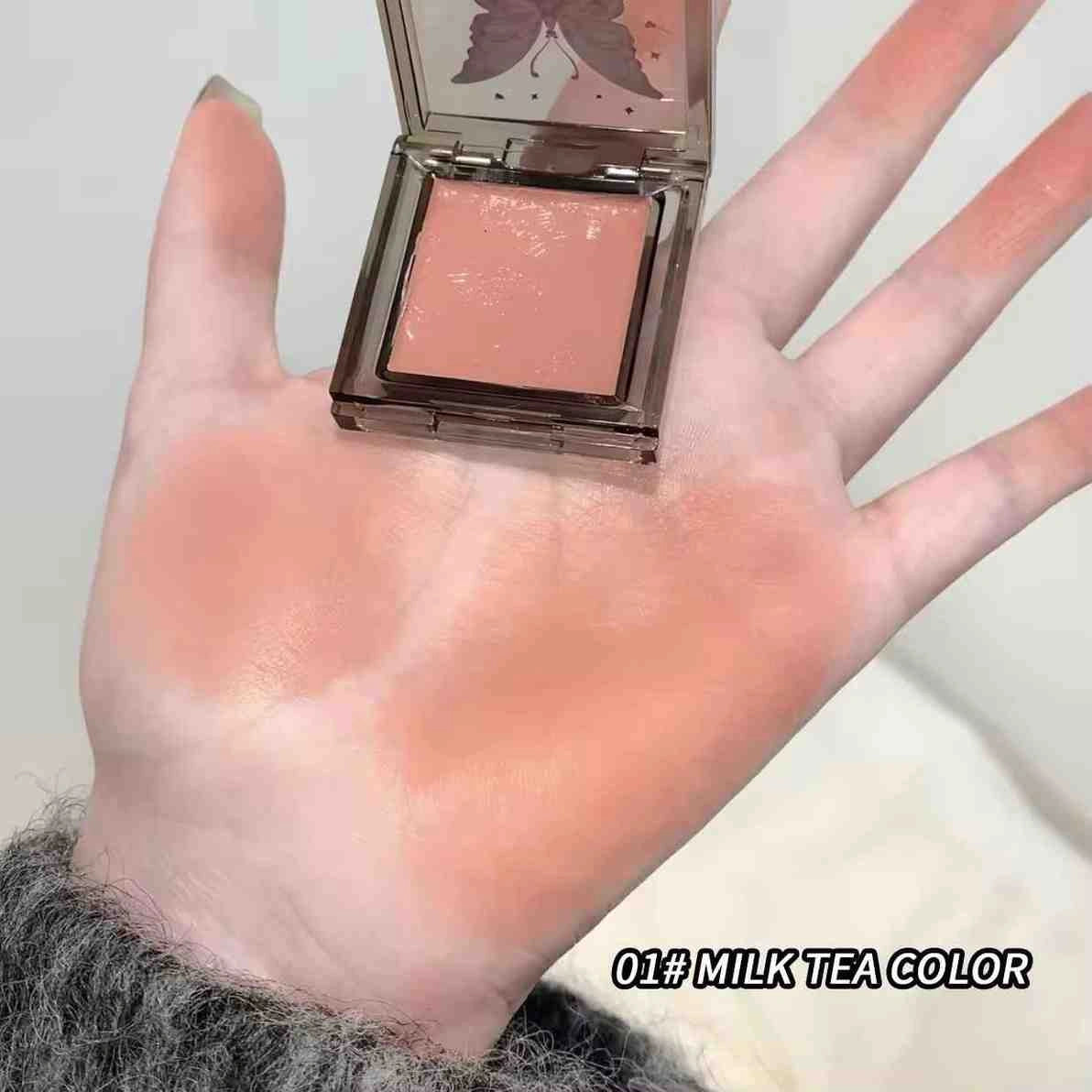 Hand holding a peach blush with 'Milk Tea Color' text on the bottom right 