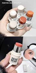 Hand holding Blushes sticks with 'GEGE BEAR' branding, including a stick.