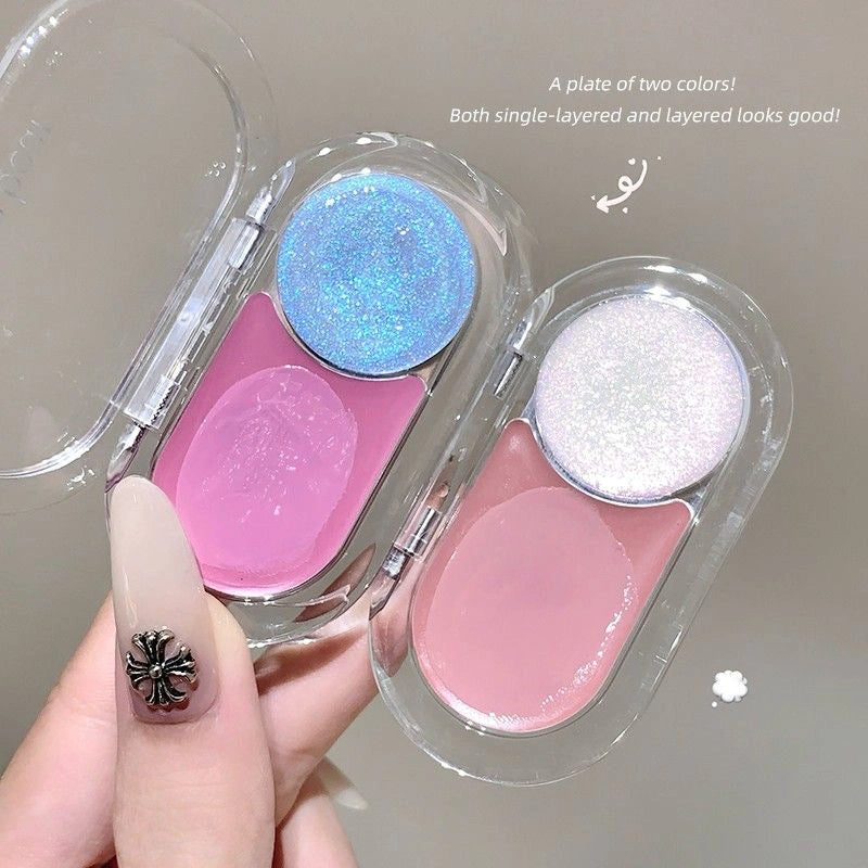 Two colorful blush palettes held by a hand with a decorative nail design.