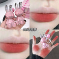 Collage of a pink bunny-shaped lipstick with close-ups on lips and hand.