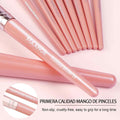 Set of pink makeup brushes with 'MAANGE' branding on a light pink background.