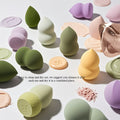 radom shaped and color beauty blender on a soild light green background 