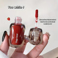 Red liquid lip gloss bottle with clear cap held by a hand, text overlay on a white background