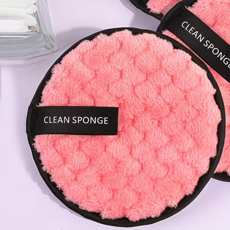 pink makeup remover pad on a white background