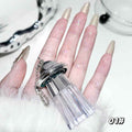 white and silve color liquid shimmer eyeshadow held on a hand of a aldy on a white background pigmentation also visible on the figers 