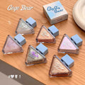 gege bear liquis shimmer eyeshadow flat lad out on a wooden table 