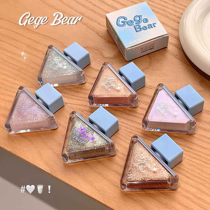 gege bear liquis shimmer eyeshadow flat lad out on a wooden table 