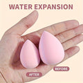 size difference of beauty blender showing before and after with a pink egged beauty sponge on a hand 