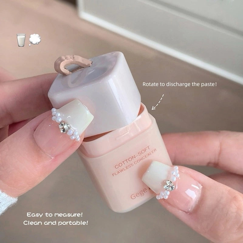 Hand holding a gege bear best concealer in nepal  and white container with text indicating features.