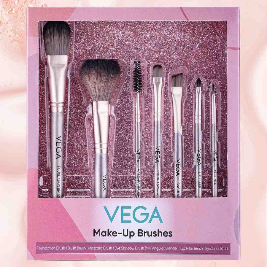Set of Vega makeup brushes in a decorative box on a pink background