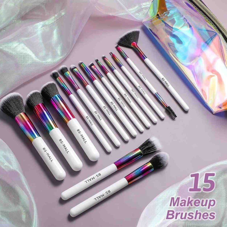 Set of 15 makeup brushes with rainbow handles on a pink background